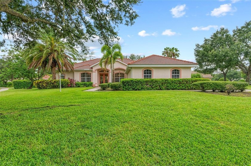Welcome to this bright and beautifully updated home in a private - Beach Home for sale in Sarasota, Florida on Beachhouse.com
