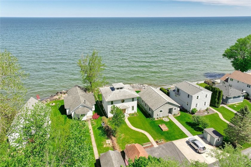 Welcome to waterfront living at its finest! Situated on 42 feet - Beach Home for sale in Hilton, New York on Beachhouse.com