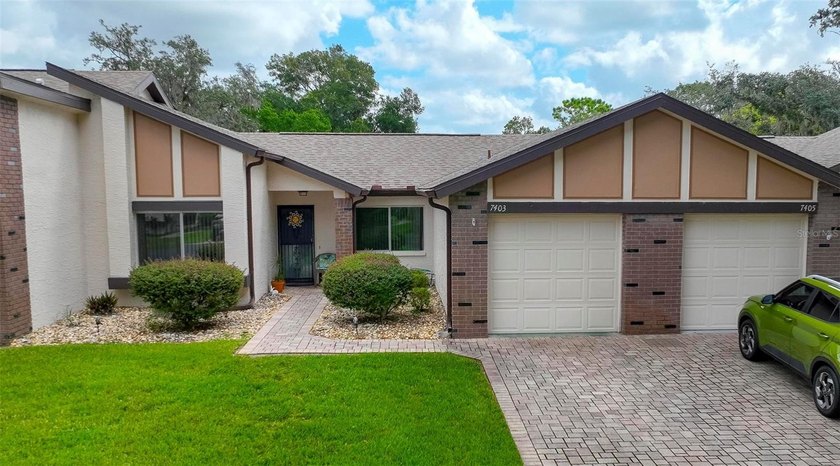 Welcome home to maintenance free living at this outstanding and - Beach Home for sale in Weeki Wachee, Florida on Beachhouse.com