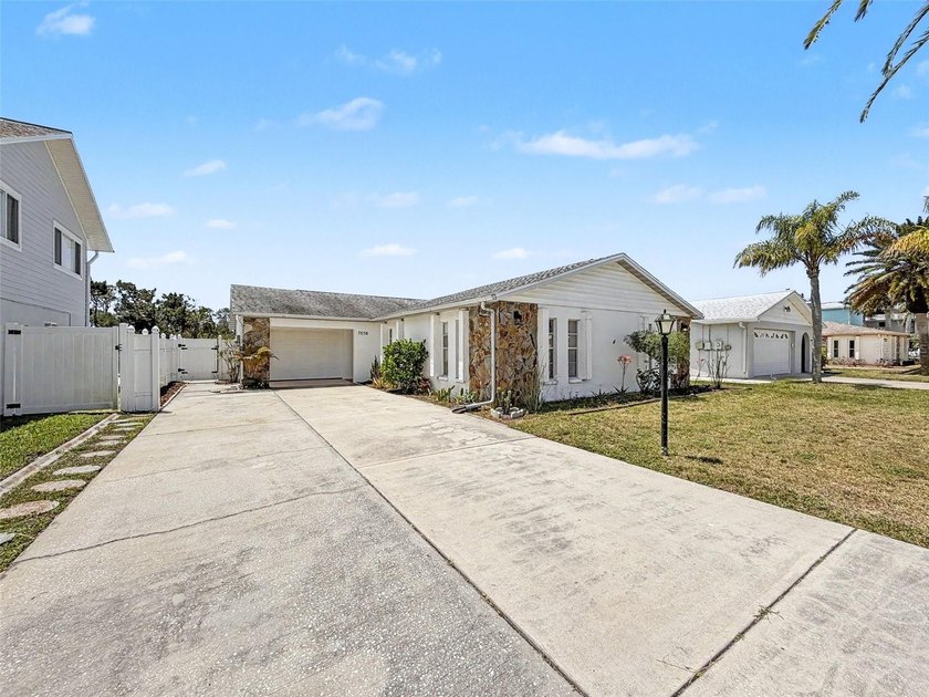 This WELL-MAINTAINED FENCED IN 3 BEDROOM, 2 BATH home is in the - Beach Home for sale in Hudson, Florida on Beachhouse.com