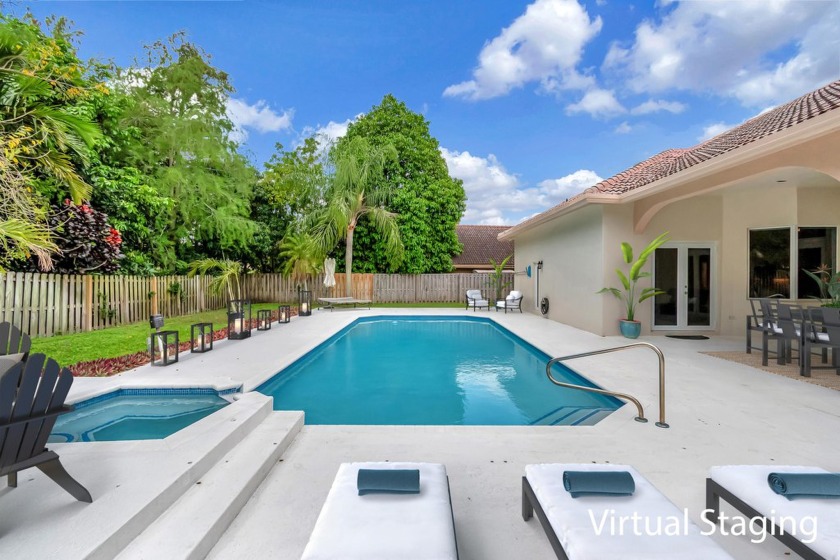 AGGRESSIVELY REDUCED TO A FIRM PRICE...INDOOR-OUTDOOR LIVING at - Beach Home for sale in Wellington, Florida on Beachhouse.com