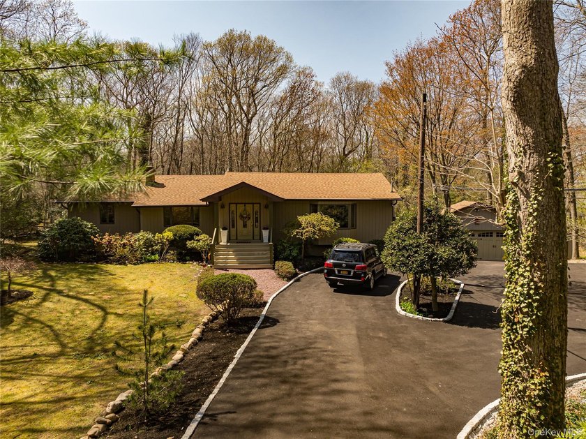 Privacy at its best! Nestled on 1.2 acres of beautifully wooded - Beach Home for sale in Northport, New York on Beachhouse.com