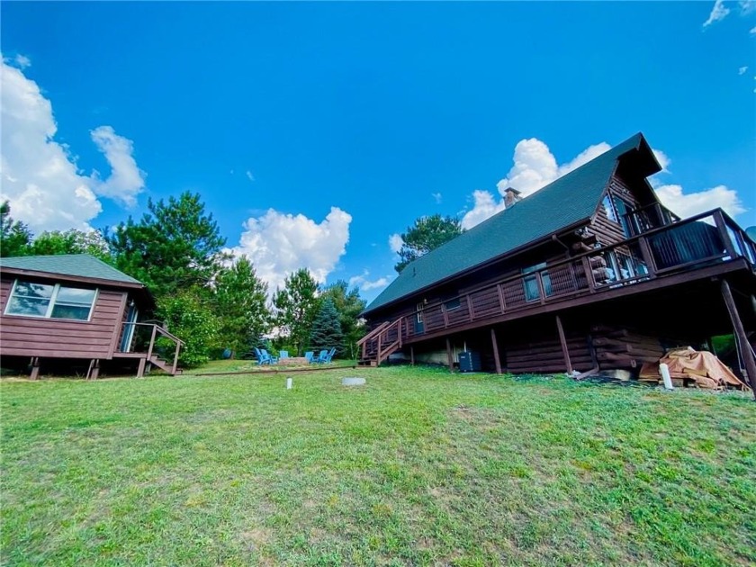 Perched on 3.02 acres of solitude you'll find this log sided gem - Beach Home for sale in Washburn, Wisconsin on Beachhouse.com