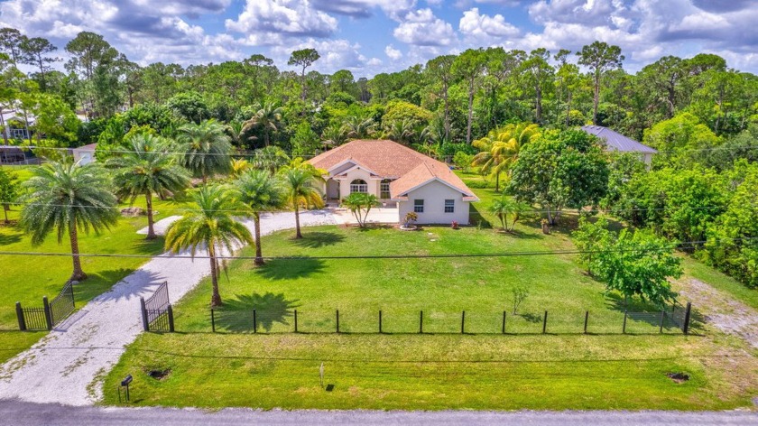 Nestled on a generous 1.15-acre lot in the serene community of - Beach Home for sale in West Palm Beach, Florida on Beachhouse.com