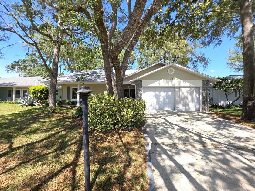 Enter The Home from The Front Porch And Dual Door Entry To - Beach Home for sale in Spring Hill, Florida on Beachhouse.com