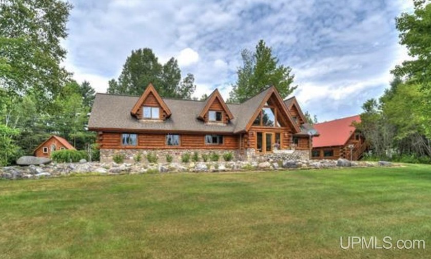 Step into a world where craftsmanship and nature exist in - Beach Home for sale in Manistique, Michigan on Beachhouse.com