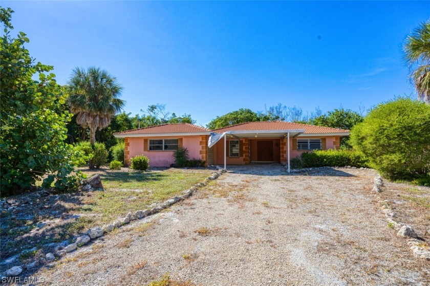 This east end canal home has a dock, with gulf access, and beach - Beach Home for sale in Sanibel, Florida on Beachhouse.com