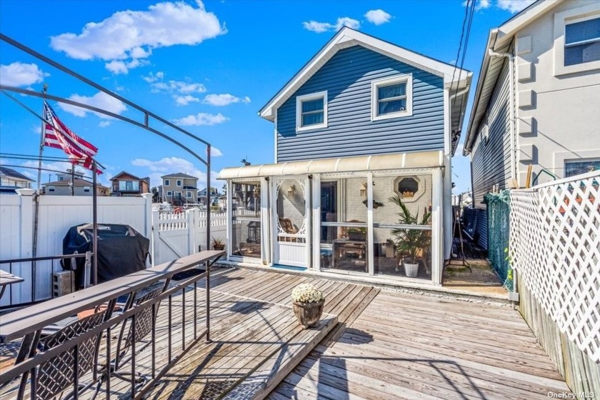 This charming 4-bedroom, 1.5-bath waterfront home offers serene - Beach Home for sale in Howard Beach, New York on Beachhouse.com