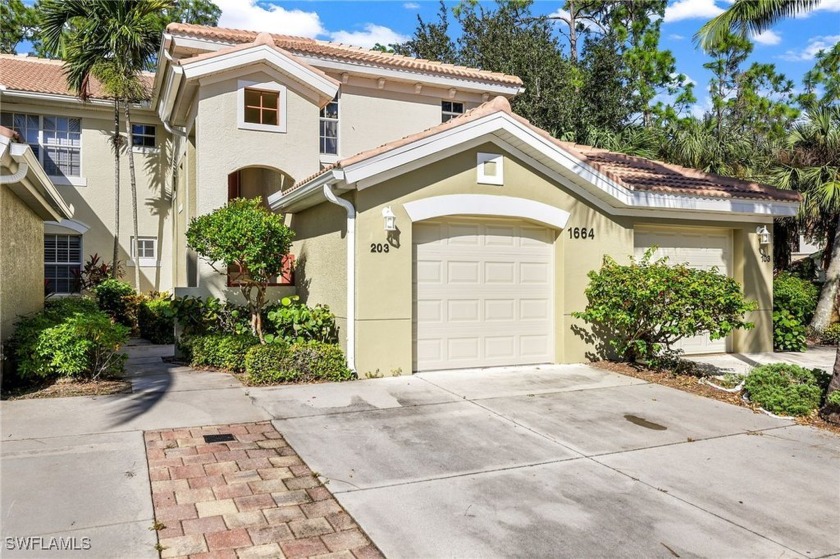 Welcome to this stunning end-unit carriage home in the highly - Beach Condo for sale in Naples, Florida on Beachhouse.com