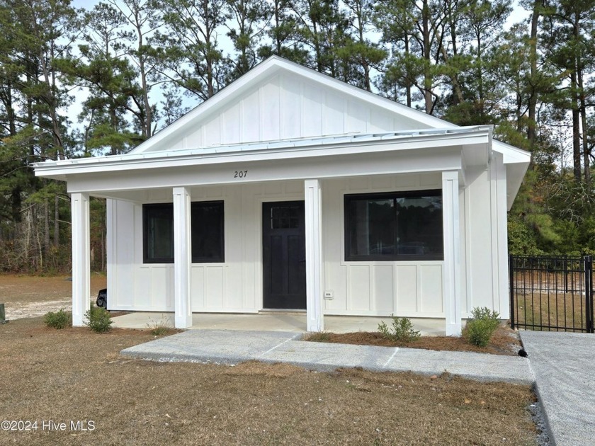 Discover Coastal Elegance at The Cabins at Old Horse a new small - Beach Condo for sale in Swansboro, North Carolina on Beachhouse.com