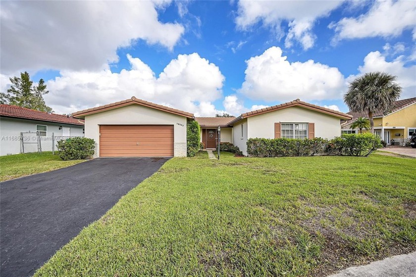 Opportunity knocks! This 4-bedroom, 2-bathroom pool home sits on - Beach Home for sale in Coral Springs, Florida on Beachhouse.com