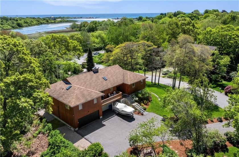 Set on an elevated, manicured corner lot with east- and - Beach Home for sale in Narragansett, Rhode Island on Beachhouse.com