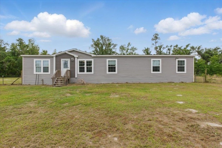 This well-maintained 2021 home offers 5 bedrooms and 3 full - Beach Home for sale in Perry, Florida on Beachhouse.com