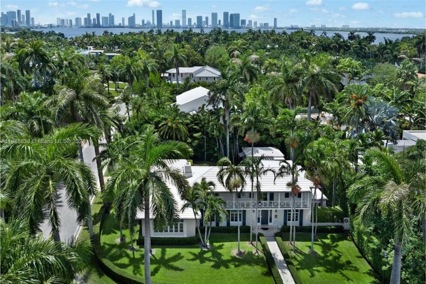 This iconic Palm Beach-inspired Colonial 4-bed/4-bath estate by - Beach Home for sale in Miami Beach, Florida on Beachhouse.com