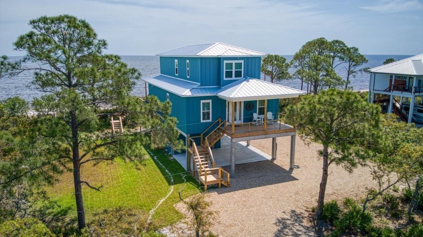Welcome to this stunning 2024-built Gulf front retreat nestled - Beach Home for sale in Alligator Point, Florida on Beachhouse.com