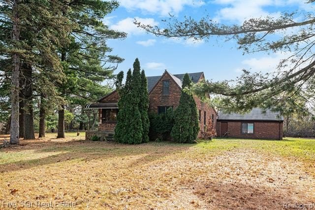 This 4-bedroom, 1-bathroom, 1.5-story home sits on a spacious - Beach Home for sale in Shelby, Michigan on Beachhouse.com