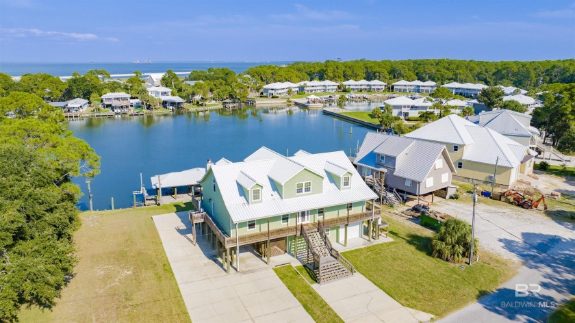 Double lot home! Waterfront retreat in sought after Colony Cove - Beach Home for sale in Dauphin Island, Alabama on Beachhouse.com