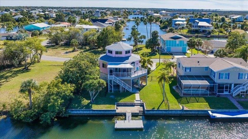 ICONIC PINK THREE-STORY OCTAGON WATERFRONT HOME with PRESERVE & - Beach Home for sale in Hernando Beach, Florida on Beachhouse.com