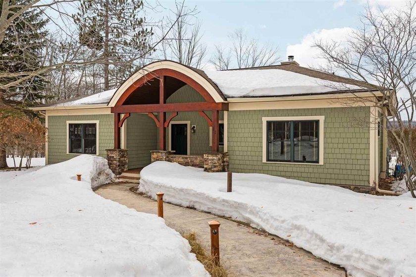 Set within the quiet landscape of True North, this thoughtfully - Beach Home for sale in Harbor Springs, Michigan on Beachhouse.com