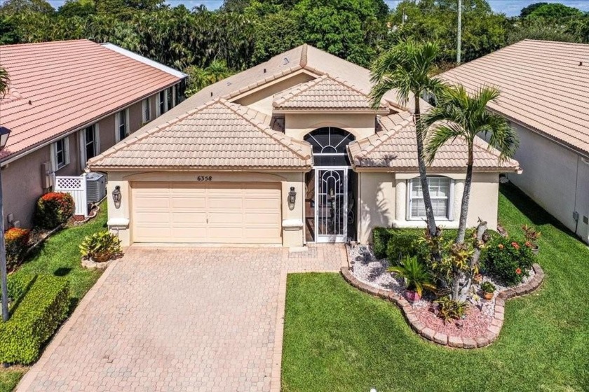 Welcome to this stunning home in a gated community and golfer's - Beach Home for sale in Boynton Beach, Florida on Beachhouse.com
