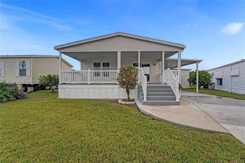 TRULY STUNNING 2/2 DOUBLE WIDE PALM ARBOR HOME, FEATURING AN - Beach Home for sale in Dania, Florida on Beachhouse.com