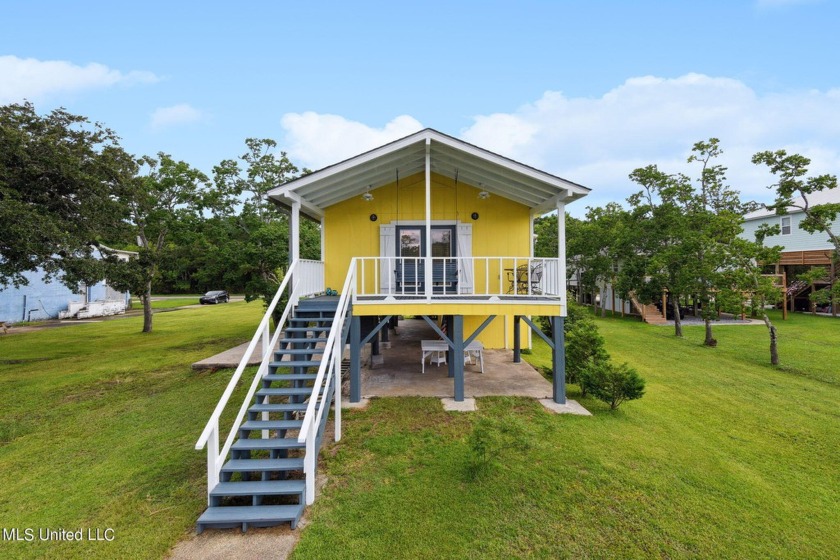 Charming one-bedroom, 1.5-bathroom waterfront cottage with - Beach Home for sale in Bay Saint Louis, Mississippi on Beachhouse.com