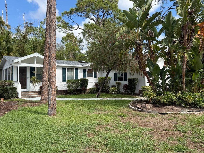 Tucked along a peaceful preserve, this 2-bedroom, 2-bath home - Beach Home for sale in North Fort Myers, Florida on Beachhouse.com