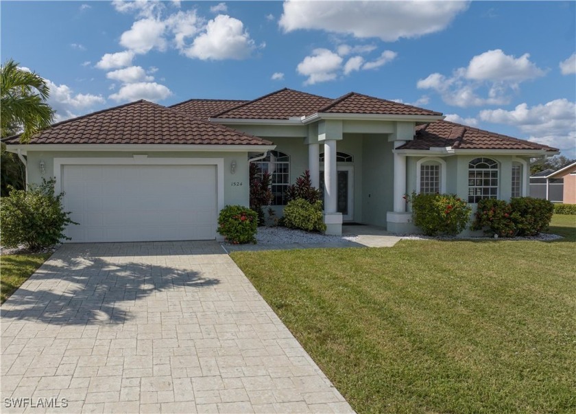 Discover your dream home in this 3-bedroom, 3-bathroom textured - Beach Home for sale in Cape Coral, Florida on Beachhouse.com