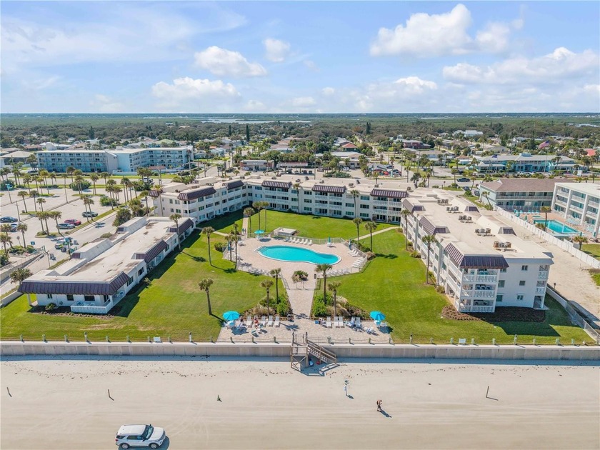 Experience the ultimate in beachside living with this fully - Beach Condo for sale in New Smyrna Beach, Florida on Beachhouse.com