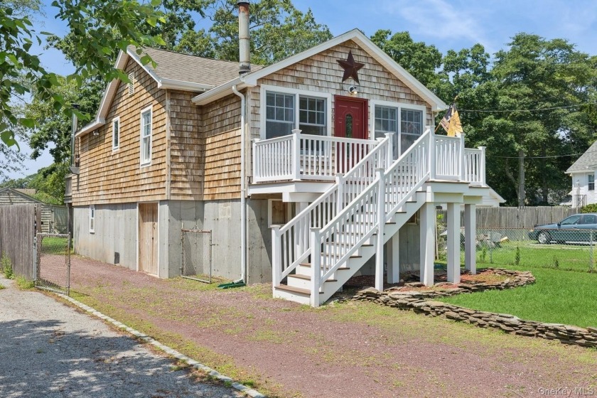 Set on two tax lots and bordered by preserved state land, this - Beach Home for sale in Mastic Beach, New York on Beachhouse.com
