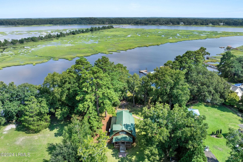 Charming waterfront home with deep water river access, featuring - Beach Home for sale in Seabrook, South Carolina on Beachhouse.com