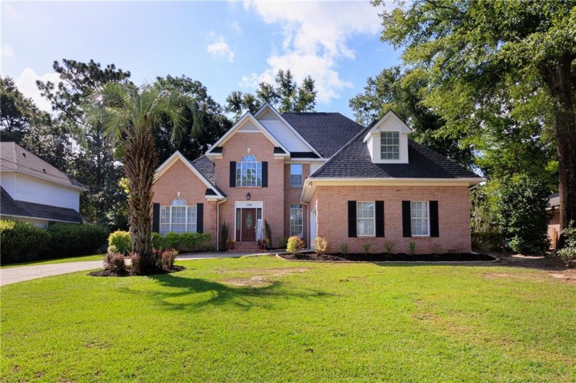 Come check out this brick beauty on the green in popular Lake - Beach Home for sale in Daphne, Alabama on Beachhouse.com