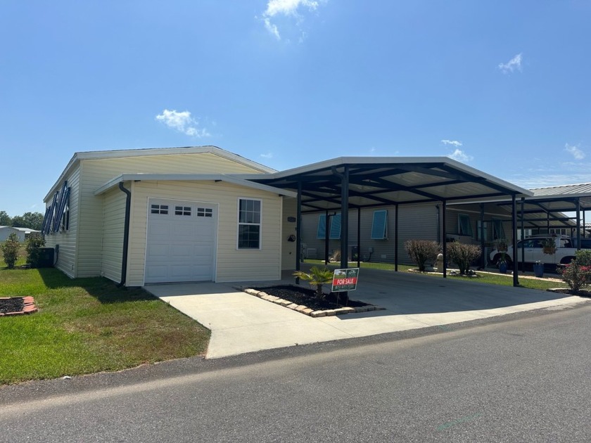 Located in the Foley Grove, a charming land-leased 55+ - Beach Home for sale in Foley, Alabama on Beachhouse.com