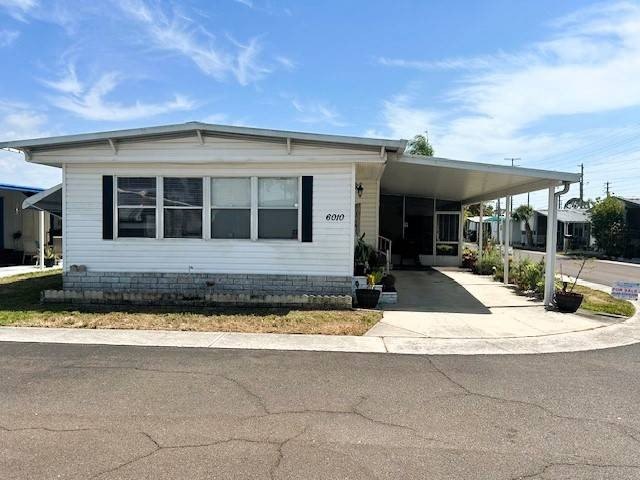 Step into this charming 24x48 vinyl-sided home offering 1352 sq - Beach Home for sale in Port Richey, Florida on Beachhouse.com