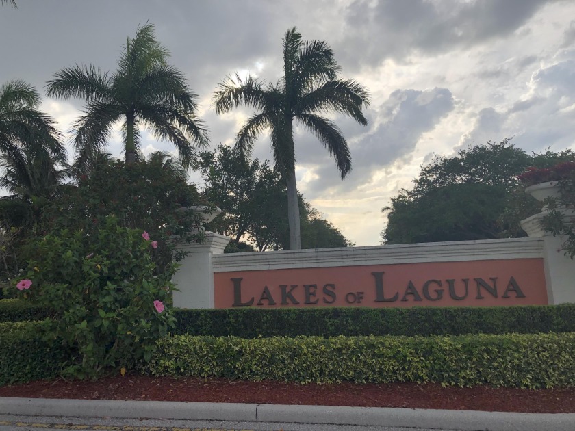 The gated community of Lakes of Laguna offers this beautiful - Beach Home for sale in West Palm Beach, Florida on Beachhouse.com