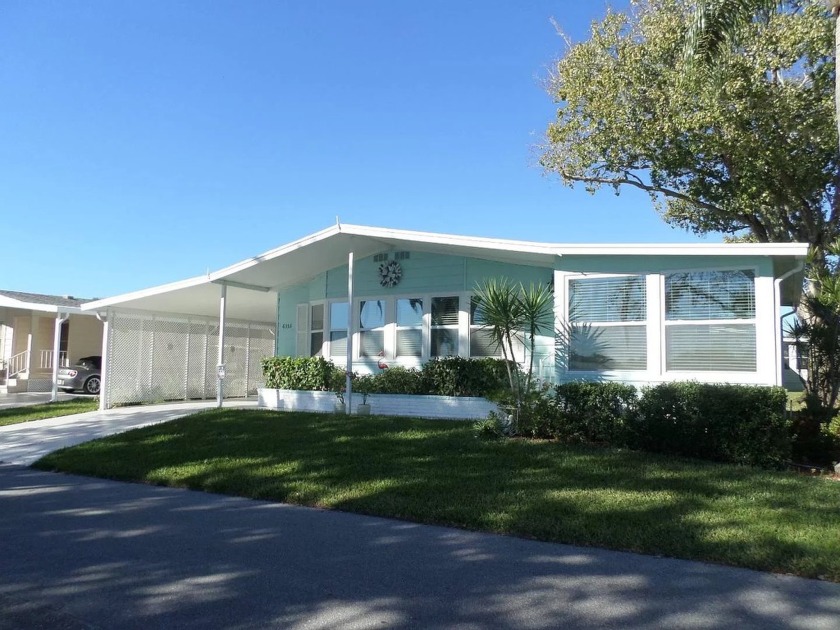 THIS HOME IS ON A LEASED LOT WITH AN APPROXIMATE MONTHLY LOT - Beach Home for sale in Sarasota, Florida on Beachhouse.com