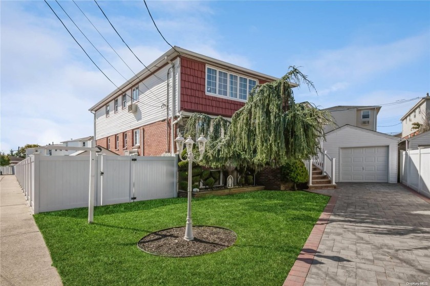 Welcome to this beautifully maintained two-family home, nestled - Beach Townhome/Townhouse for sale in New York, New York on Beachhouse.com