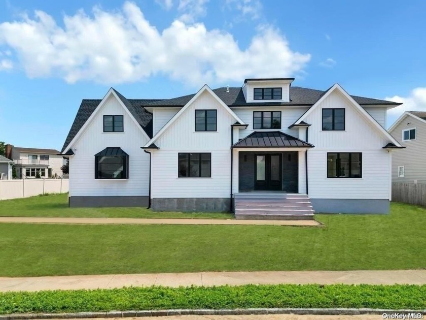 Welcome to luxury waterfront living at its finest! Nestled along - Beach Home for sale in Massapequa, New York on Beachhouse.com