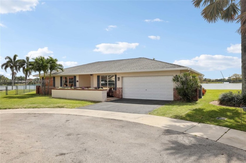 Experience serene lakeside living in this spacious 2,000+ sq. ft - Beach Home for sale in Oakland Park, Florida on Beachhouse.com