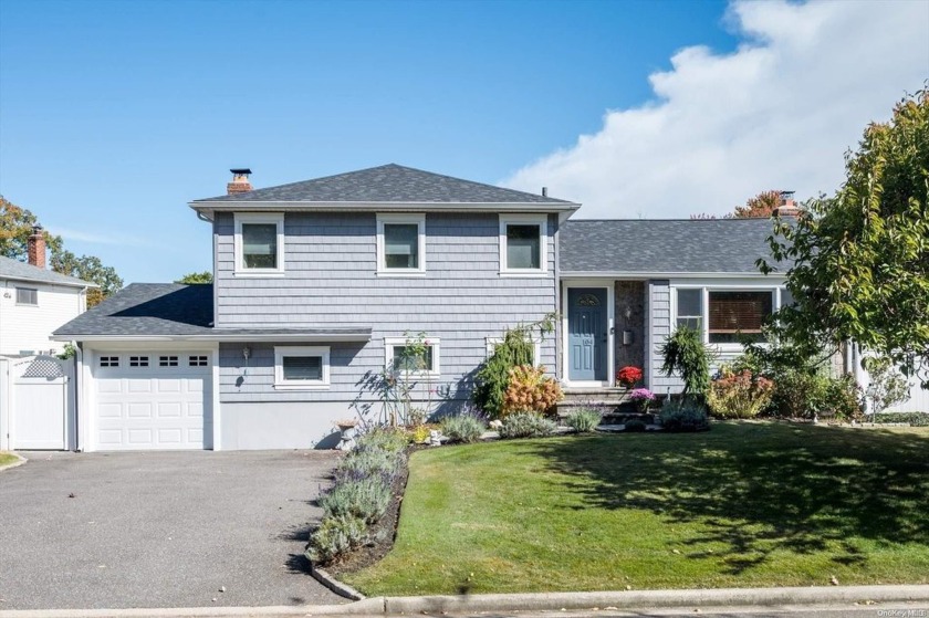 Property lovers delight. This expanded split level home is - Beach Home for sale in Oyster Bay, New York on Beachhouse.com