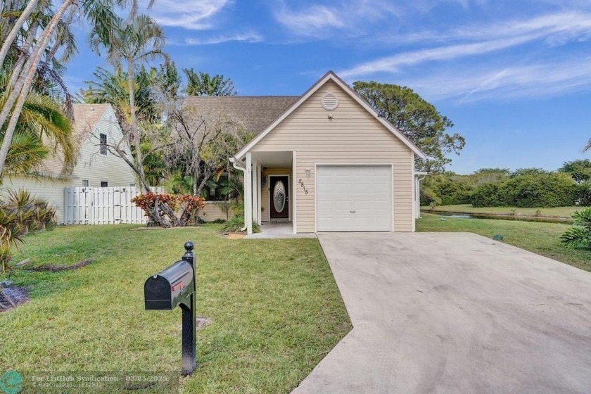 Welcome to this adorable 3-bedroom, 2-bath home tucked away in a - Beach Home for sale in Lake Worth, Florida on Beachhouse.com