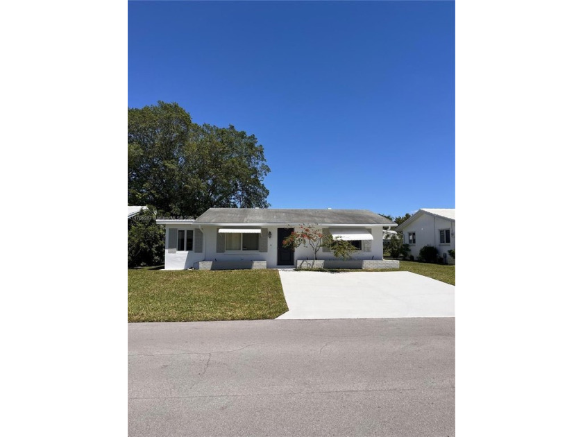 This charming waterfront home is nestled in the desirable 55+ - Beach Home for sale in Tamarac, Florida on Beachhouse.com