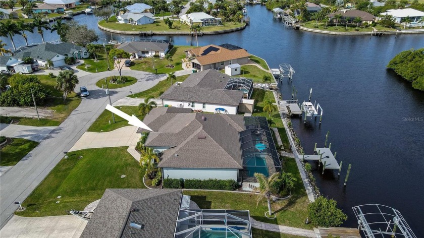 FANTASTIC PRICE IMPROVEMENT  WATERFRONT POOL HOME WITH DIRECT - Beach Home for sale in Port Charlotte, Florida on Beachhouse.com