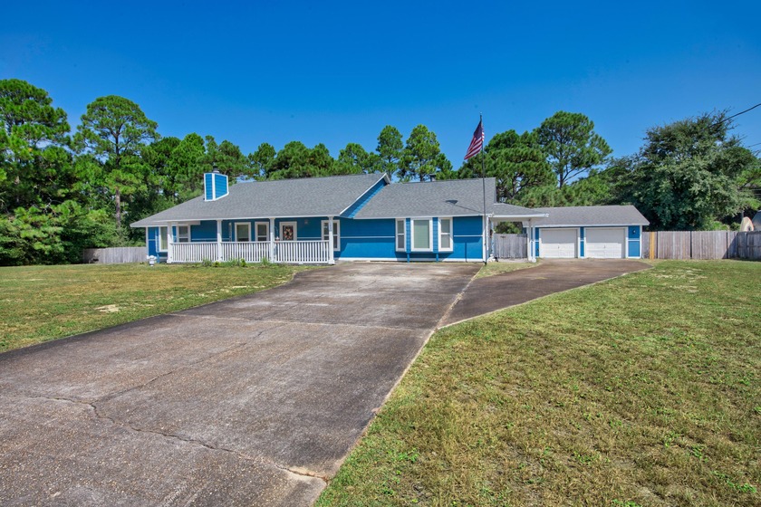 Set on nearly an acre and one of the highest elevation points in - Beach Home for sale in Navarre, Florida on Beachhouse.com