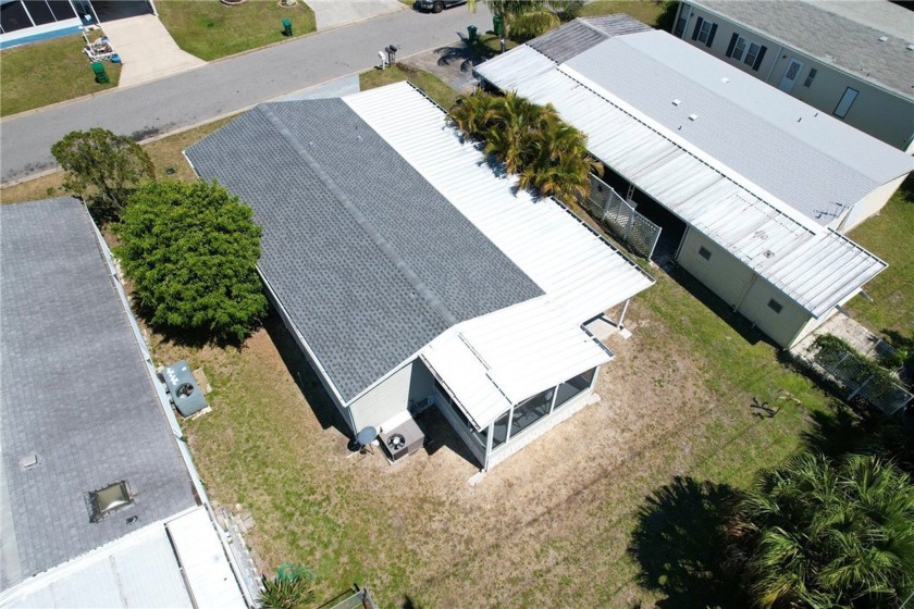 This home, built in 2002, not only offers a newer roof but also - Beach Home for sale in Barefoot Bay, Florida on Beachhouse.com