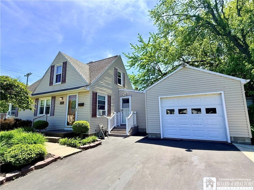 This charming Cape-style home sits on a desirable corner lot *on - Beach Home for sale in Dunkirk, New York on Beachhouse.com