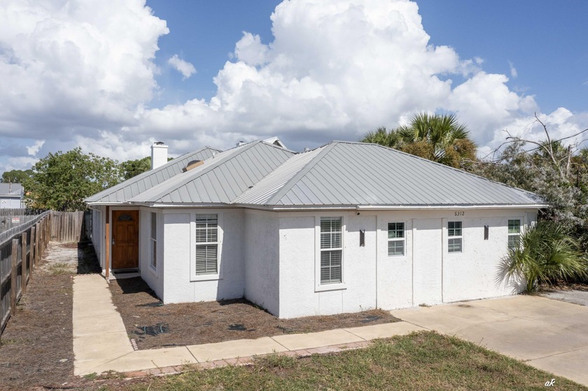 Just steps from the beach, this beautifully updated coastal home - Beach Home for sale in Panama City Beach, Florida on Beachhouse.com