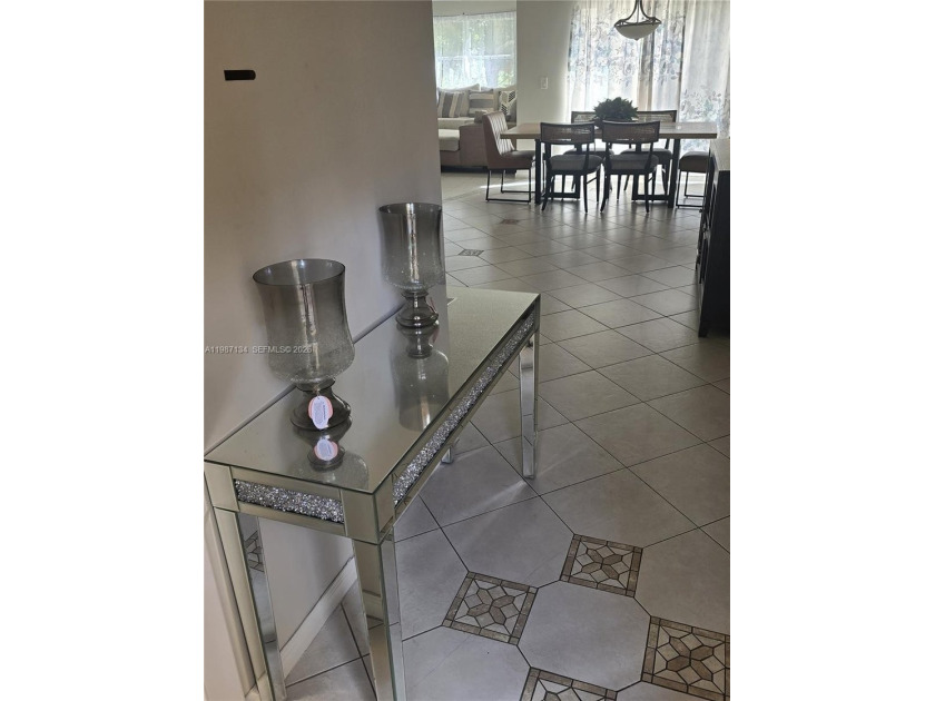 Discover this immaculate single-family home in the Sienna Green - Beach Home for sale in Lauderhill, Florida on Beachhouse.com