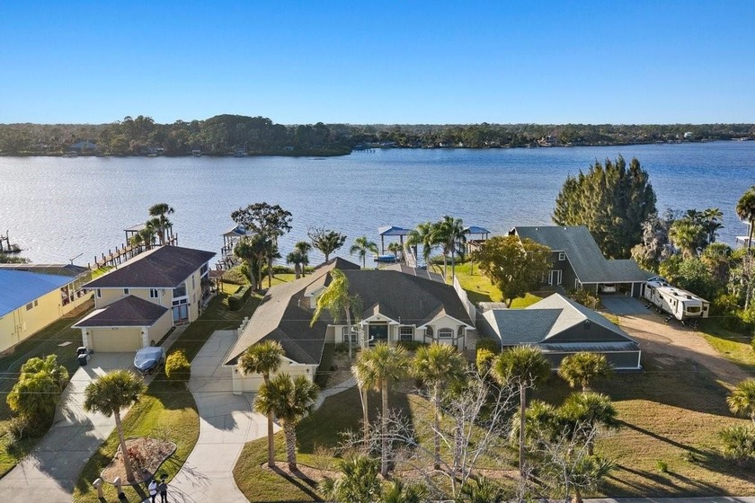 Gracefully positioned on a rare 0.63-acre estate lot along - Beach Home for sale in New Smyrna Beach, Florida on Beachhouse.com