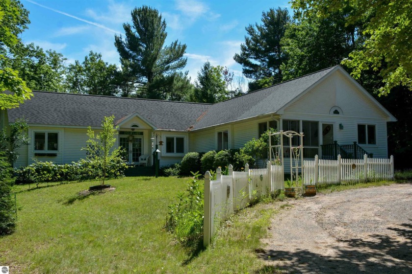 Nestled in the serene embrace of Northern Michigan, this gem - Beach Home for sale in Maple City, Michigan on Beachhouse.com